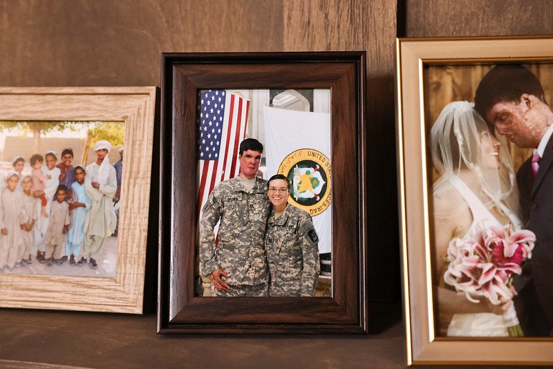 Framed photos of Sam Brown and Amy Brown with family