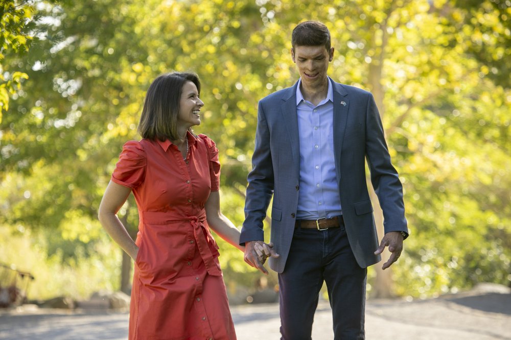 Sam Brown and Amy Brown walking together, holding hands